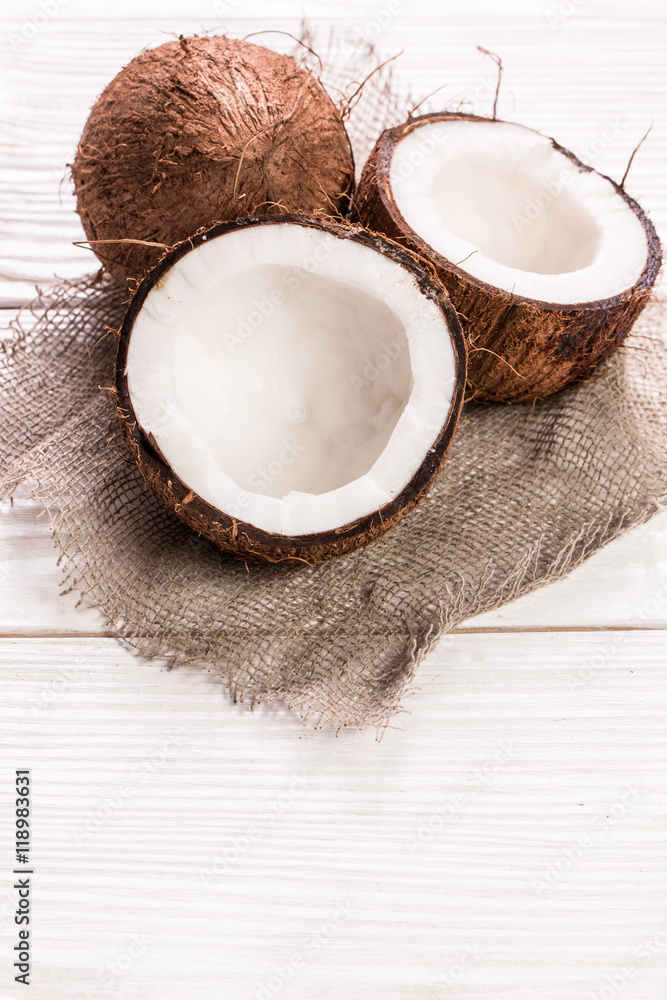 Coconut on wooden table.