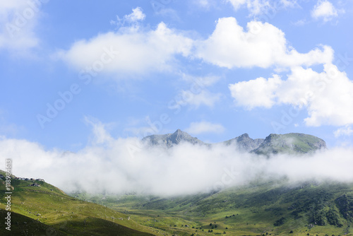 beautiful traditional plateau life and green nature on the mountains with fog