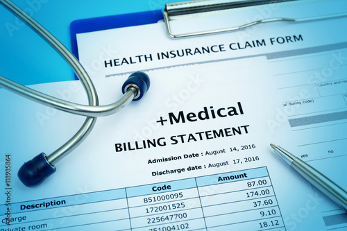 Healthcare cost concept with medical bill and health insurance claim form