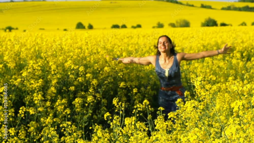 Happy woman running and jumping on field, steadycam shot, slow motion shot at 240fps
Happy woman running and jumping on field, steadycam shot, slow motion shot at 240fps