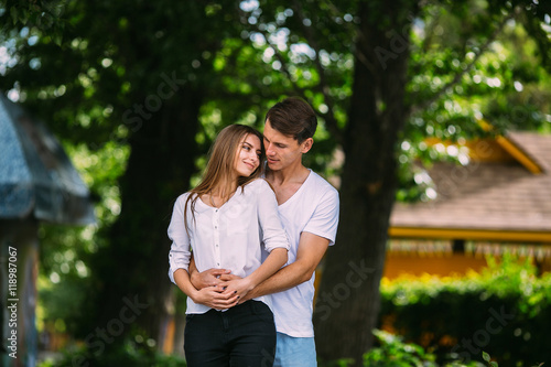 Young adult brunette man and woman in the park © teksomolika