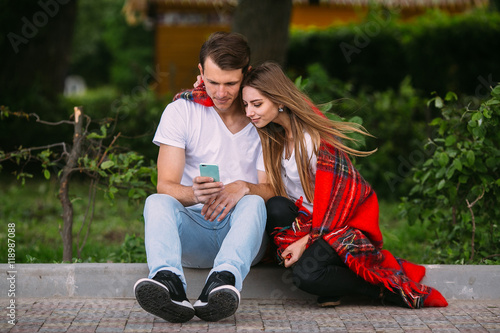 Beautiful young couple relaxing in the park