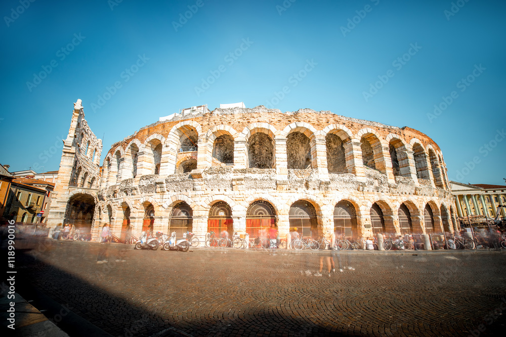Roman amphitheatre on Bra square in Verona city in Italy. Long exposure image technic with blurred people