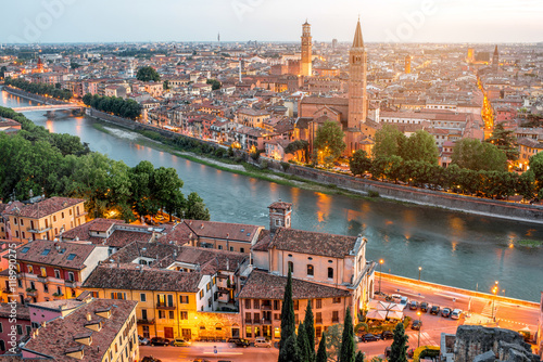 Verona panoramic aerial view on illuminated old town on the sunset in Italy photo