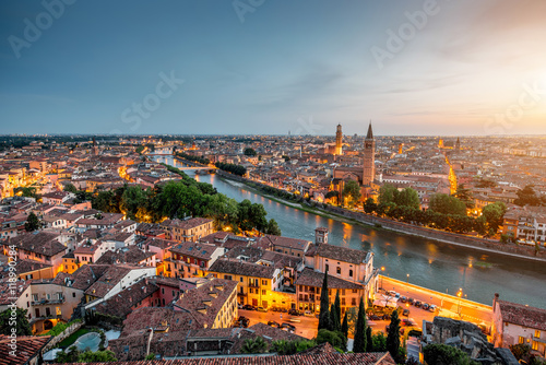 Verona panoramic aerial view on illuminated old town on the sunset in Italy