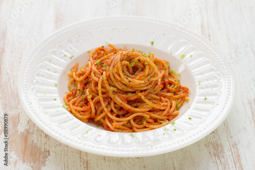 spaghetti with sauce on white plate