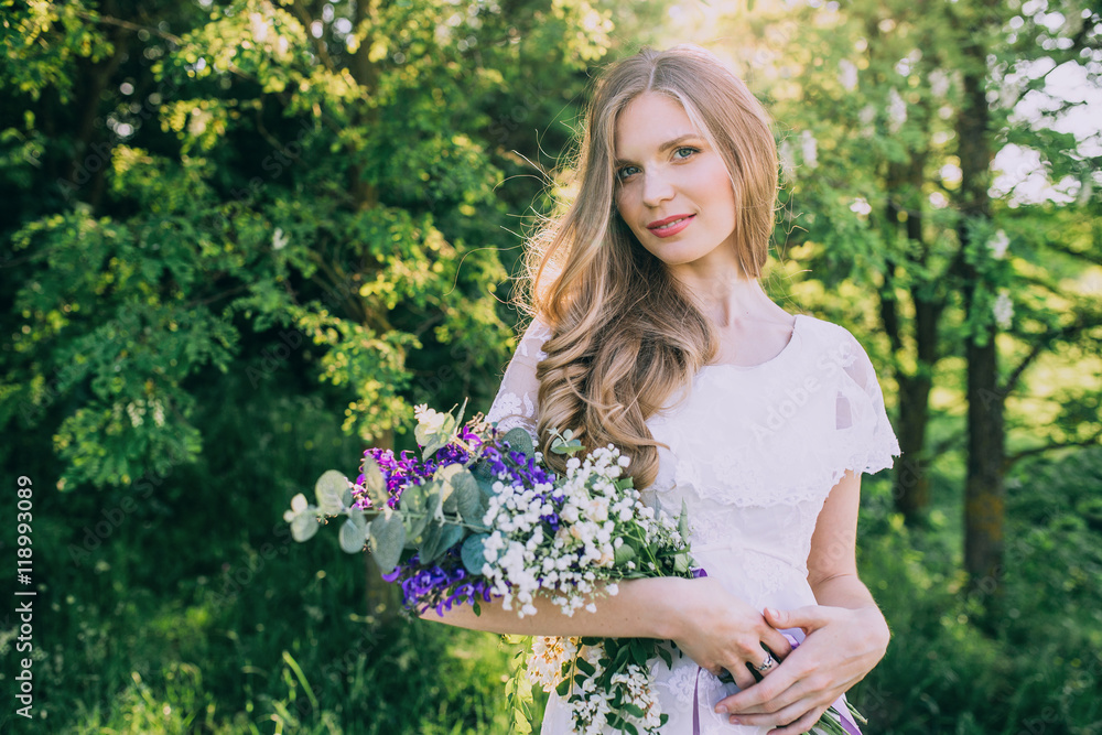 stylish boho bride holding rustic bouquet of amazing flowers stylish boho bride holding rustic bouquet of amazing flowers