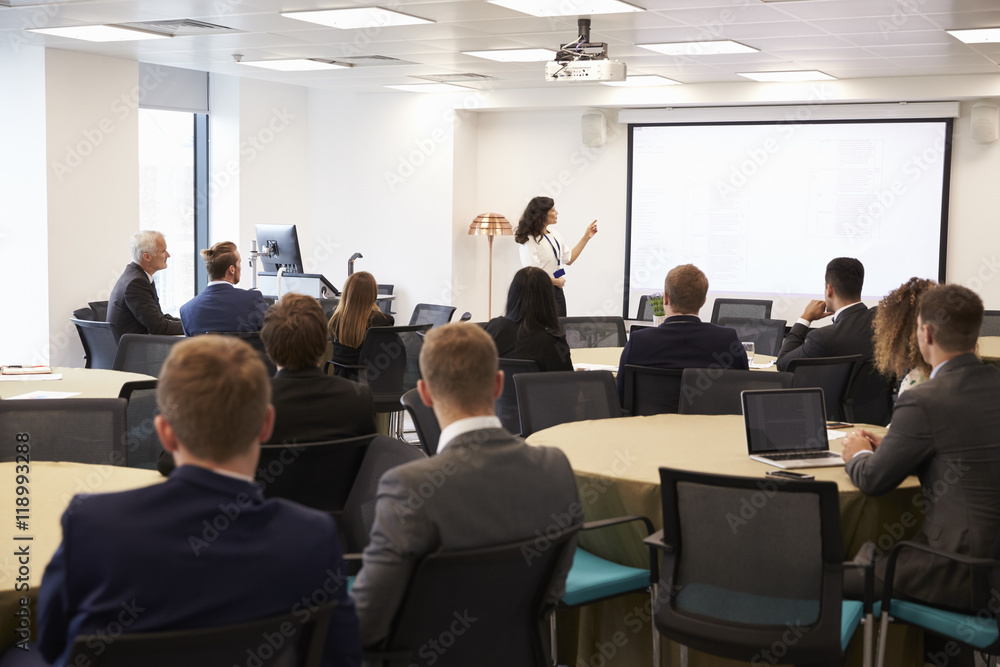 Businesswoman Making Presentation At Conference