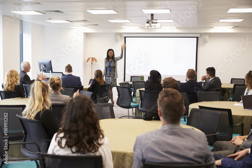 Businesswoman Making Presentation At Conference