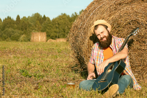 Wallpaper Mural man with guitar and beer on the nature Torontodigital.ca