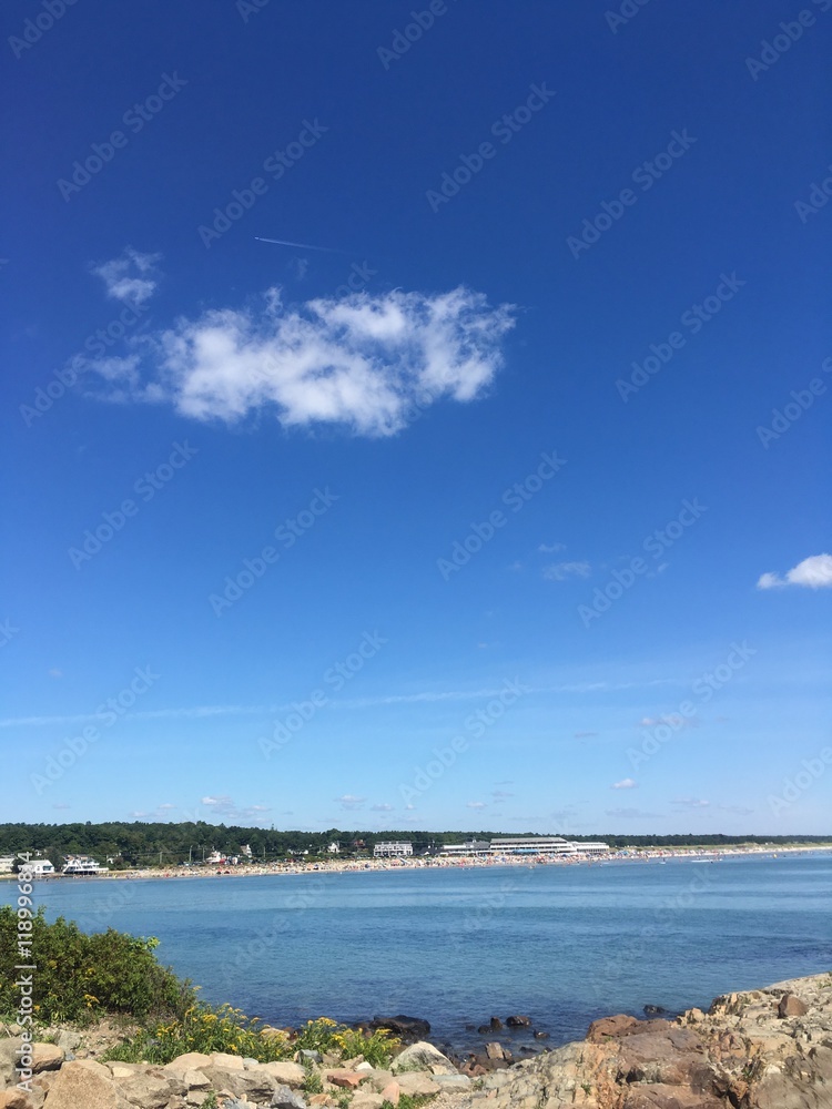 blue sky and cloud over sunny Ogunquit beach in Maine