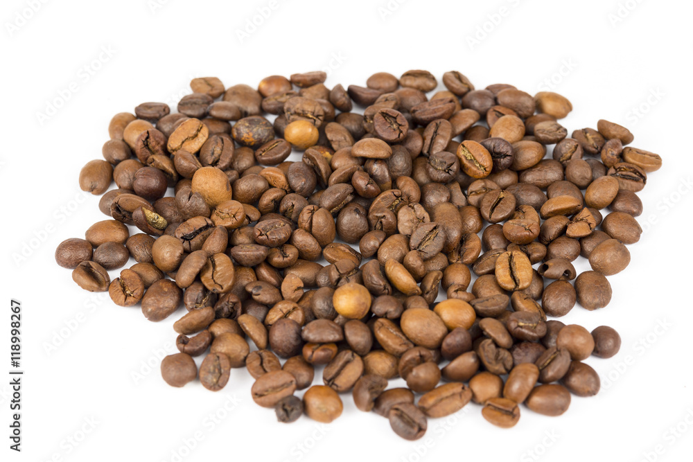 Heap of roasted coffee beans isolated on white Heap of roasted coffee beans isolated on white