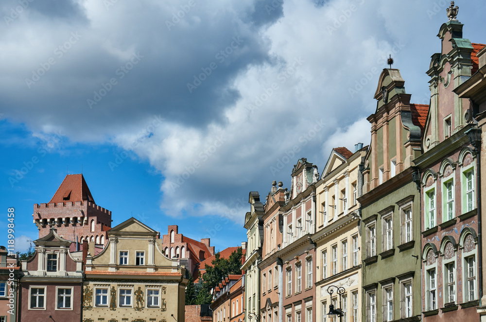 Townhouses in the Old Market Square and the tower of the Royal Castle in Poznan.