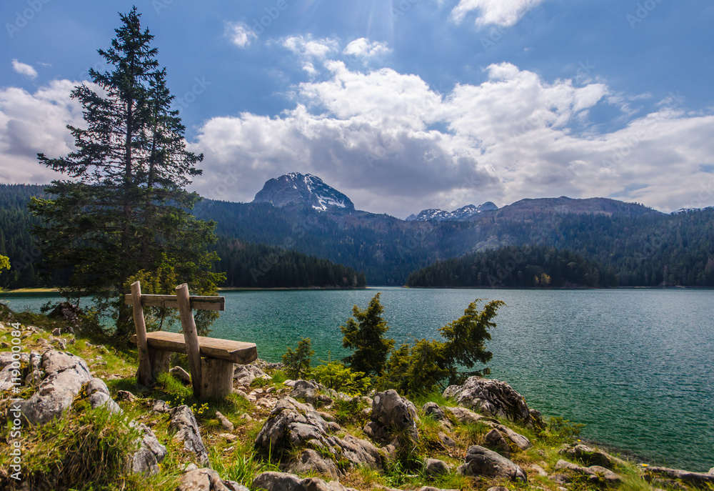 Wooden bench on the shore of Black Lake in Montenegro