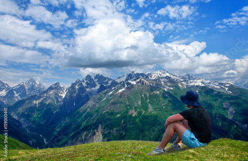 Tired hiker relaxes on slope in the mountains © tns2710