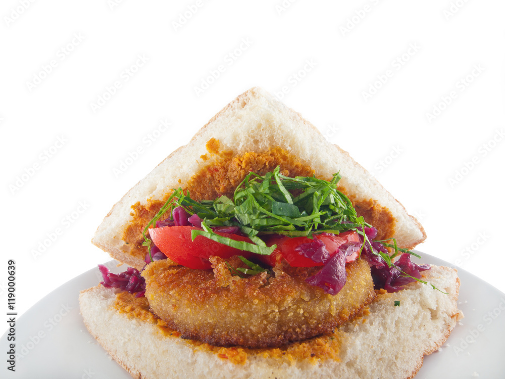 vegan flatbread with breaded spiced tofu, mashed eggplant and carrot spread and vegetables