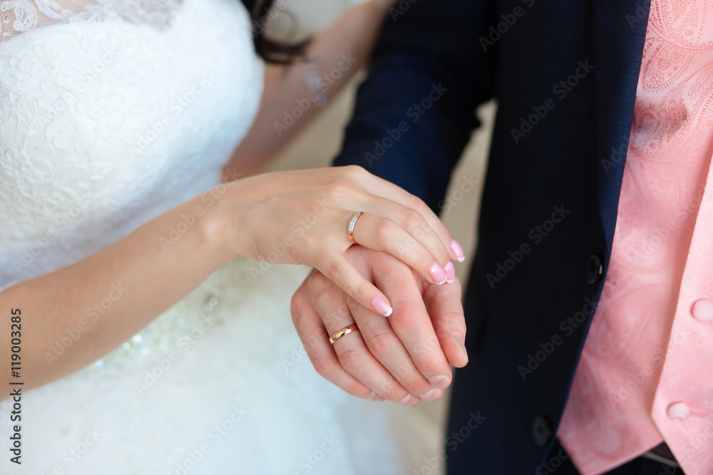 Hands of the bride and groom with wedding rings Hands of the bride and groom with wedding rings