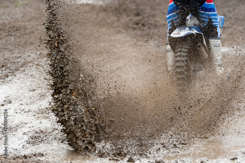 Motocross rider make huge mud splash