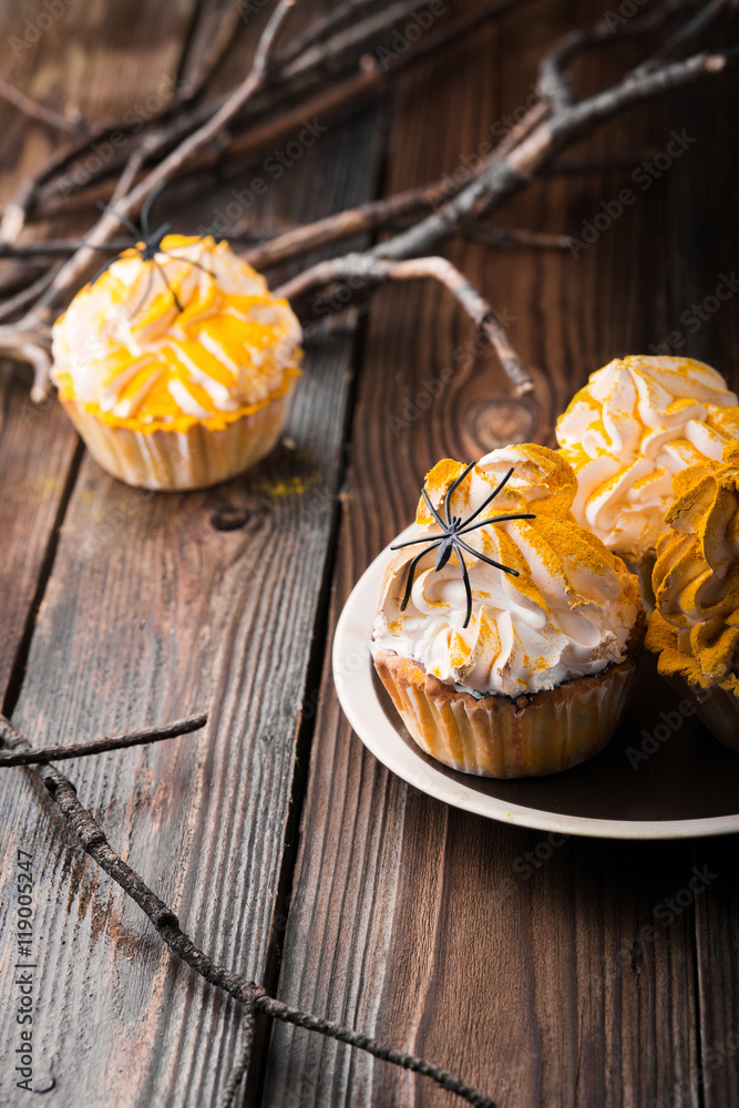 Halloween cupcakes on rusty table Halloween cupcakes on rusty table