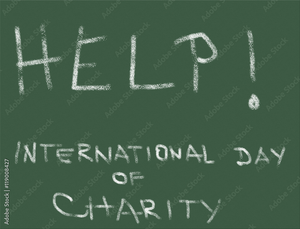 Word Help, International Day of Charity, written on a blackboard with chalk Word Help, International Day of Charity, written on a blackboard with chalk