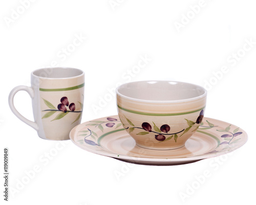 Painted cup, bowl and plate separated on white background
