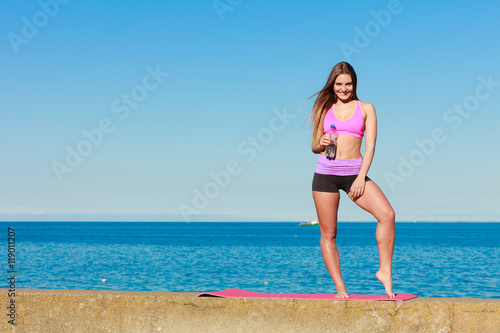 Woman with water after workout