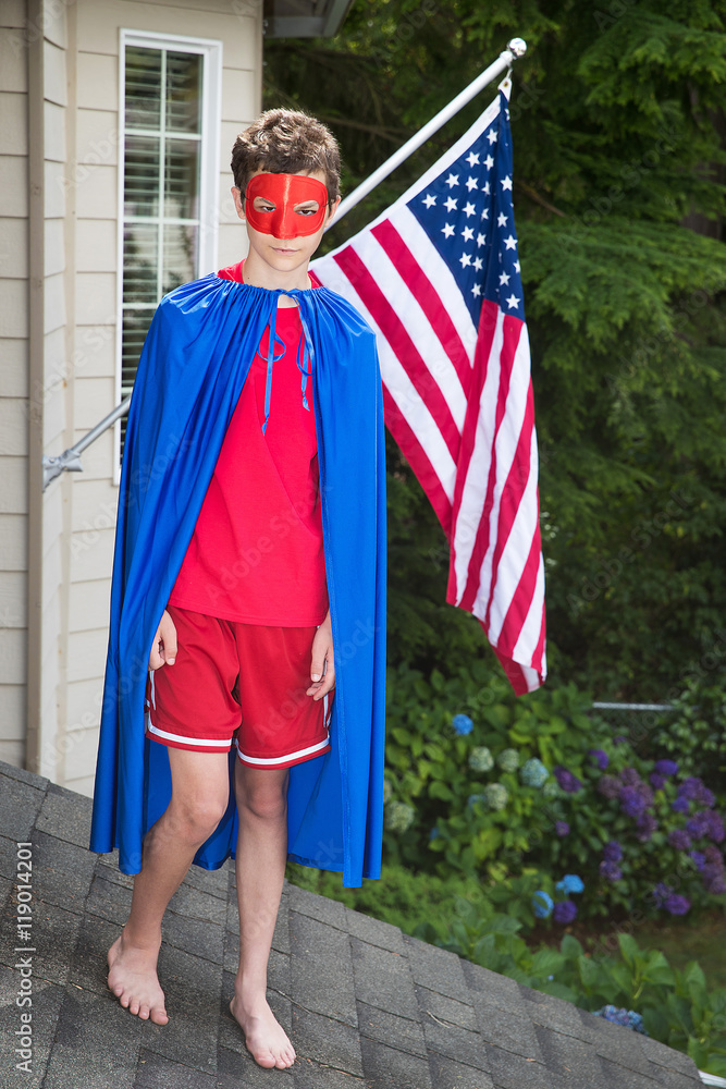 Young boy in a superhero costume