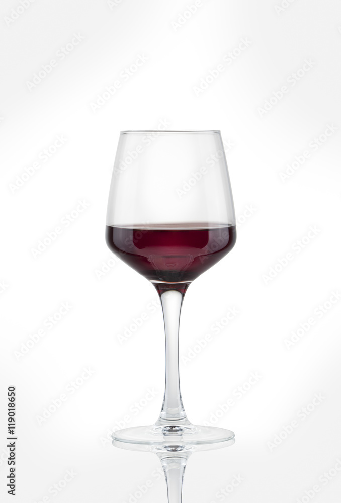 glass with red wine on a white background. glass with red wine on a white background.