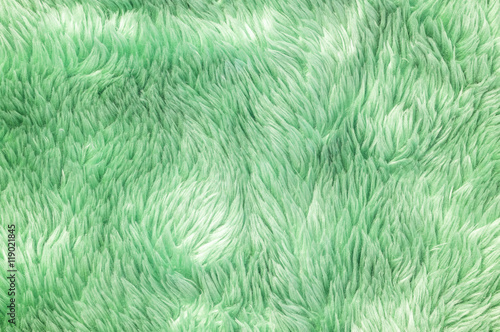 Closeup surface abstract fabric pattern at the green fabric carpet at the floor of house texture background