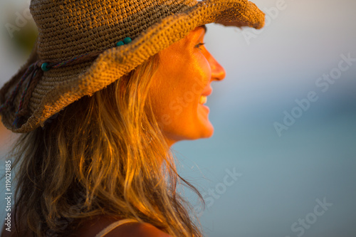 young woman staying back of the head in summer light