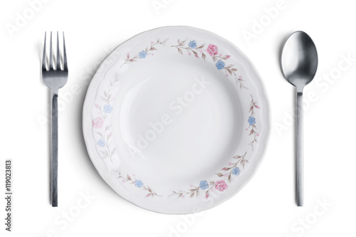 A white plate with silver fork and spoon