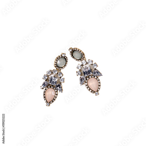 Pair of earrings with semiprecious stones on white background.