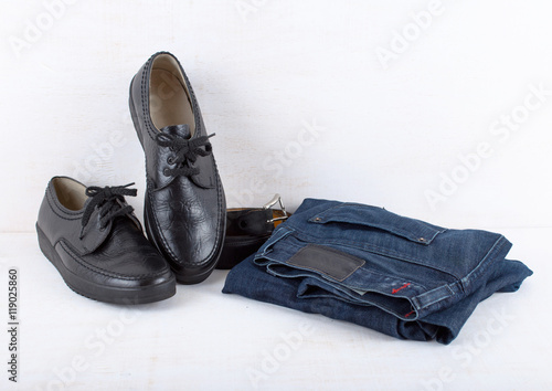 Set of mens casual clothes on white wooden background