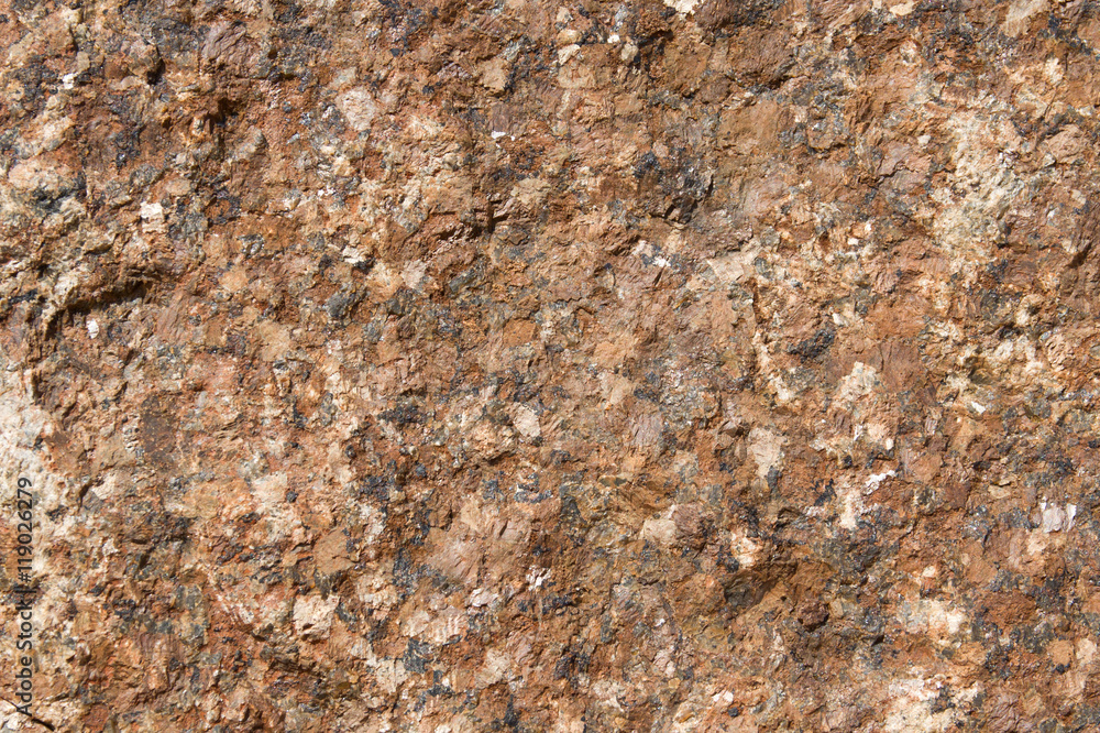 Bright brown granite texture with natural pattern. Background of natural stone. Bright brown granite texture with natural pattern. Background of natural stone.