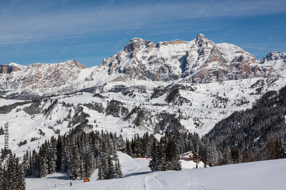 View of the Alpe di Fanes cliffs in winter, with the peaks Conturines and Piz Lavarella, Alta Badia, Italian Dolomites.