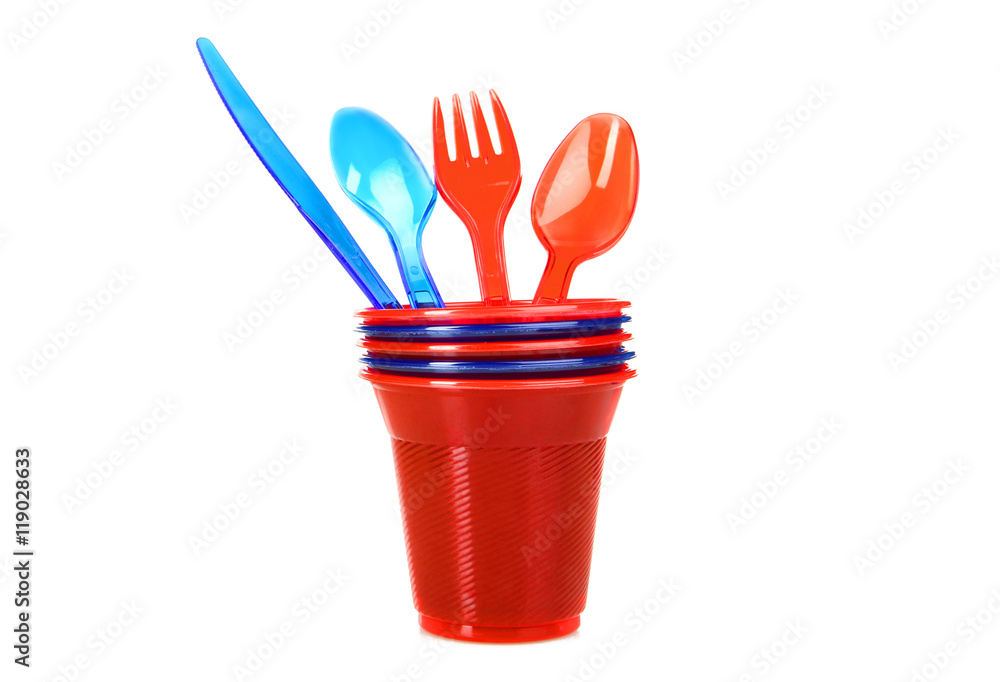Plastic tableware on a white isolated background Plastic tableware on a white isolated background