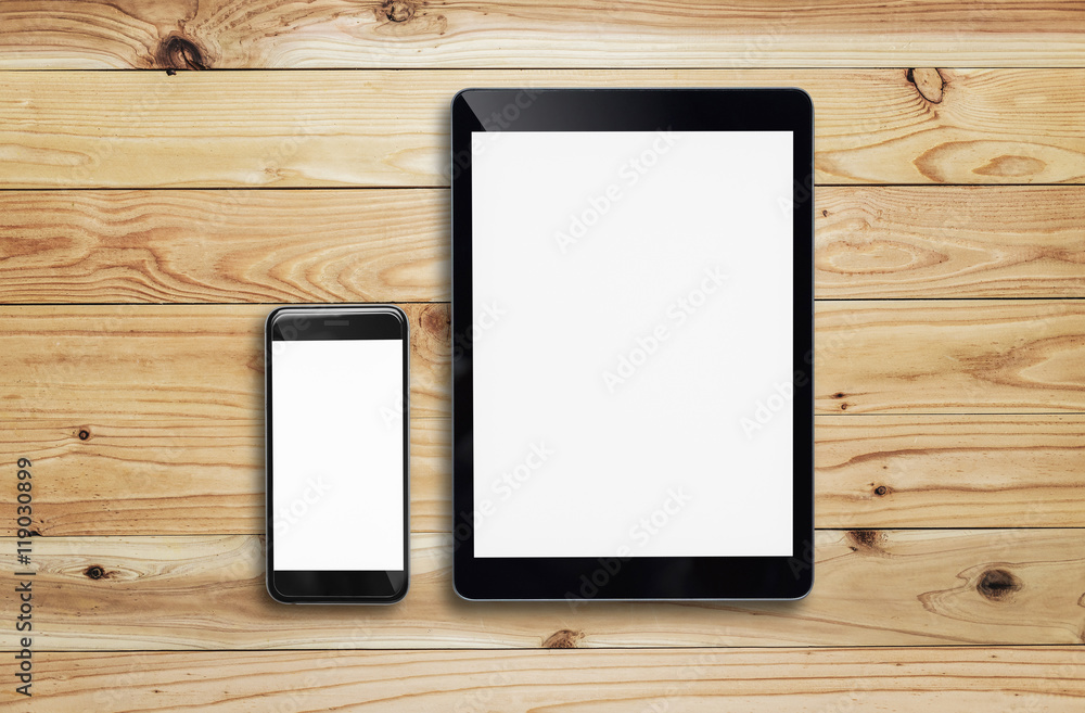 Tablet and smartphone on wood table. Tablet and smartphone on wood table.