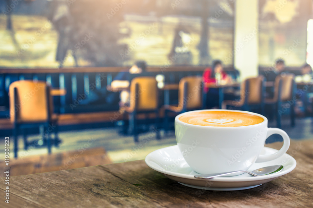 Fototapeta premium Coffee cup in coffee time on blur people in coffee shop backgrou