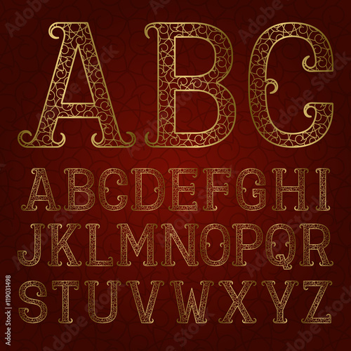 Golden ornamental letters with flourishes on red patterned background. Vintage decorative font. Isolated latin alphabet.