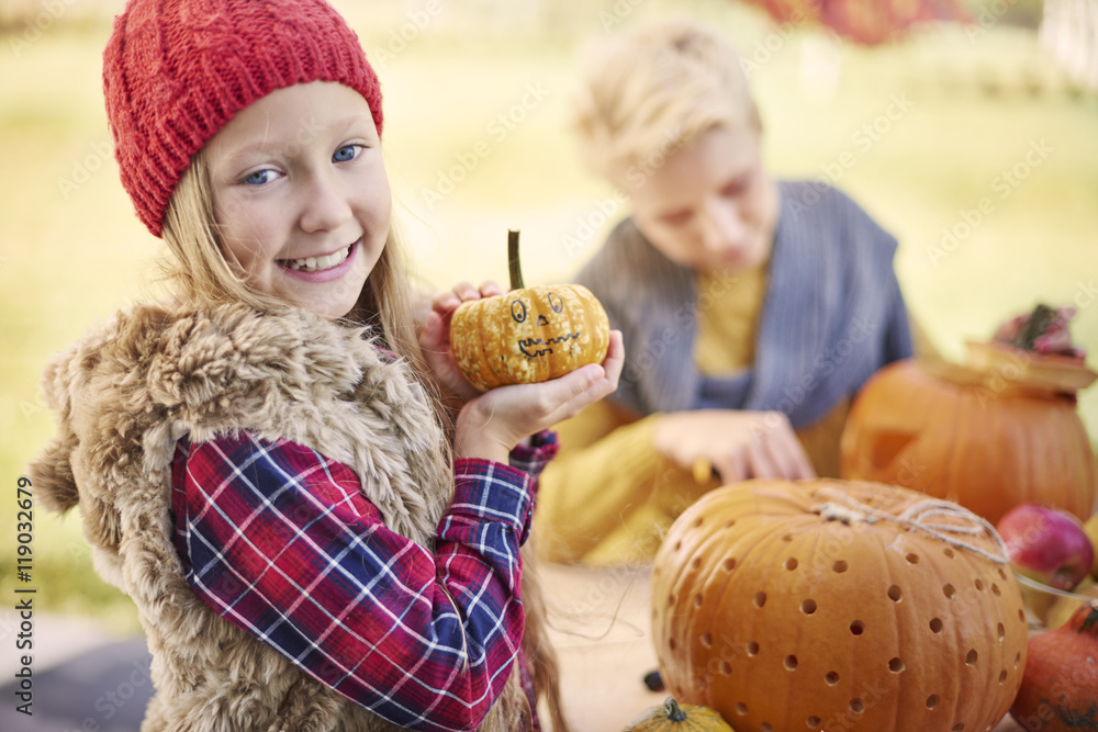 Portrait of sweet little girl with pumpkin Portrait of sweet little girl with pumpkin