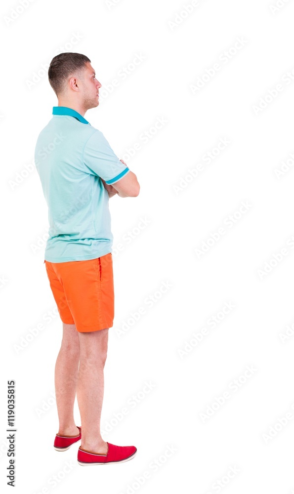 Back view of young manin shorts looking.  Rear view people collection.  backside view of person.  Isolated over white background.
