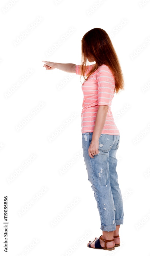 Back view of pointing woman. beautiful redhaired girl . girl shows something to someone. Rear view people collection. backside view of person. Isolated over white background. Girl in a white T Back view of pointing woman. beautiful redhaired girl . girl shows something to someone. Rear view people collection. backside view of person. Isolated over white background. Girl in a white T