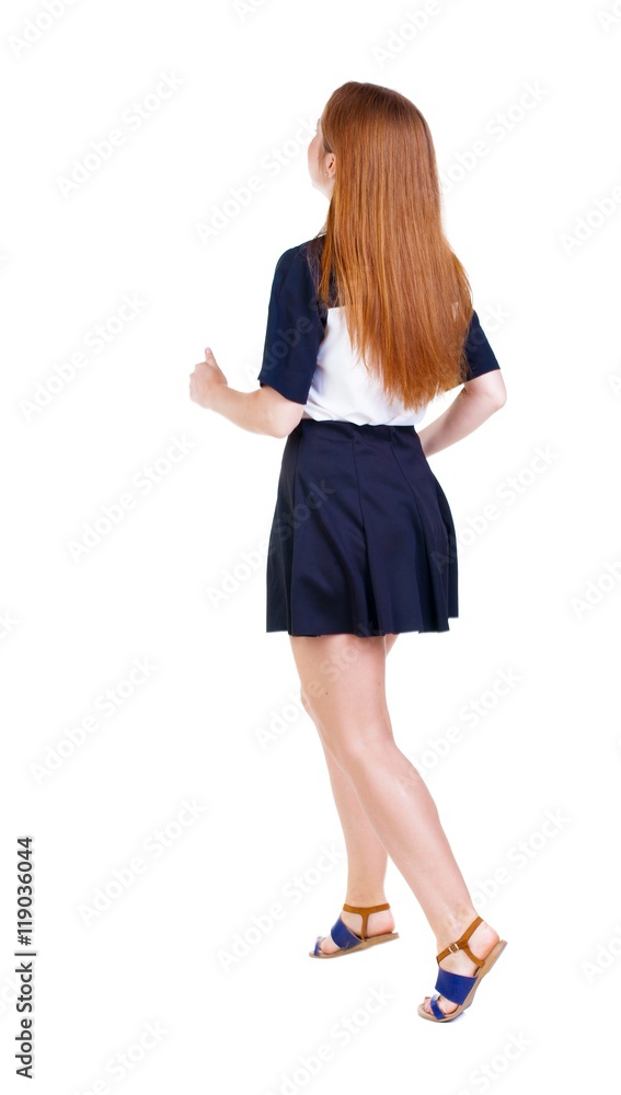 back view of running woman in dress. beautiful redhead girl in motion. backside view of person. Rear view people collection. Isolated over white background. back view of running woman in dress. beautiful redhead girl in motion. backside view of person. Rear view people collection. Isolated over white background.