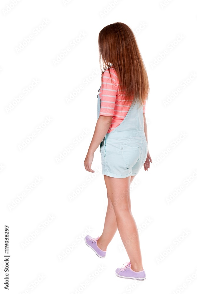 back view of walking woman. beautiful redhead girl in motion. backside view of person. Rear view people collection. Isolated over white background. back view of walking woman. beautiful redhead girl in motion. backside view of person. Rear view people collection. Isolated over white background.