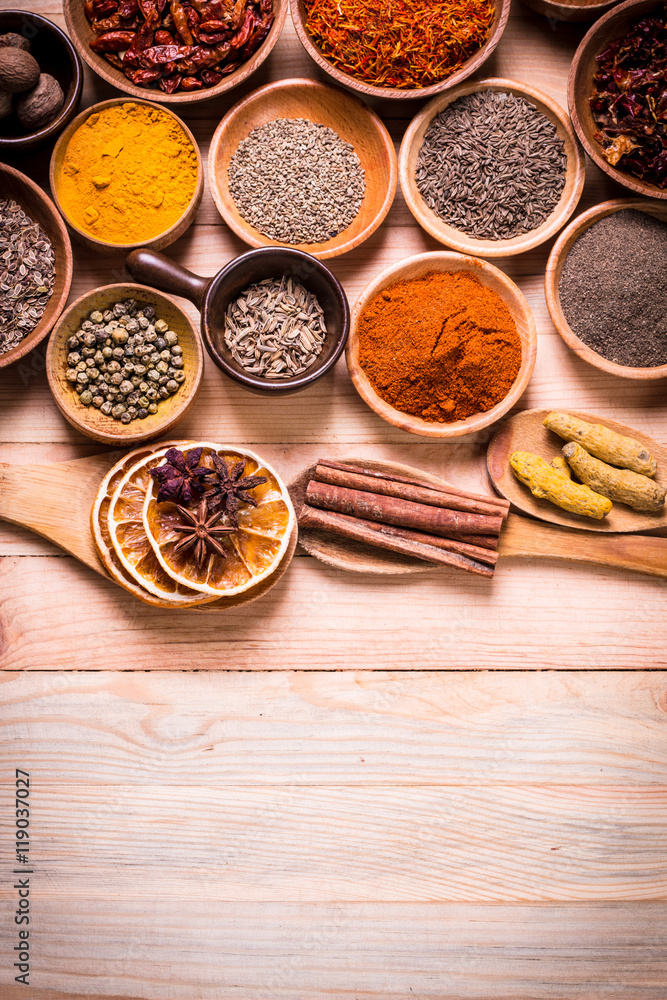 Obraz premium spices and herbs on wooden table , medicinal concept