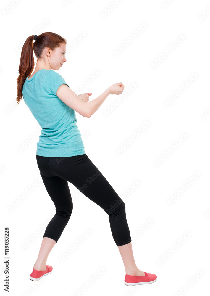 back view of standing woman pulling a rope from the top or cling to something. Rear view people collection. backside view of person. Isolated over white background. Sport girl in black tights back view of standing woman pulling a rope from the top or cling to something. Rear view people collection. backside view of person. Isolated over white background. Sport girl in black tights