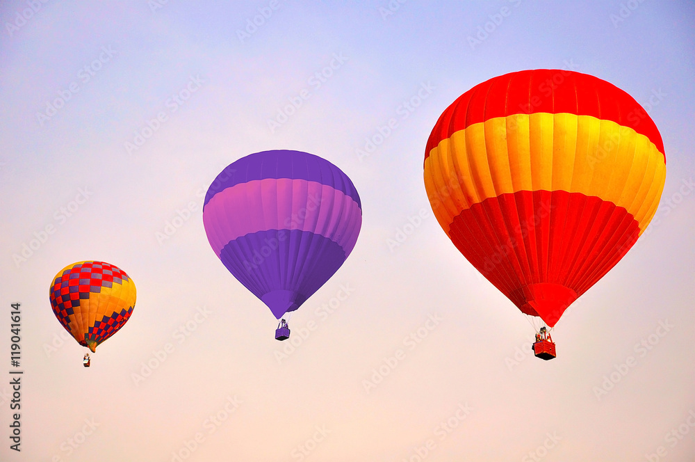 Colorful hot air balloons flying at sunrise Colorful hot air balloons flying at sunrise
