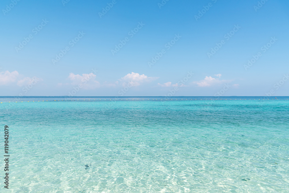 Beautiful white sand on Tropical beach blue water and blue sky Beautiful white sand on Tropical beach blue water and blue sky