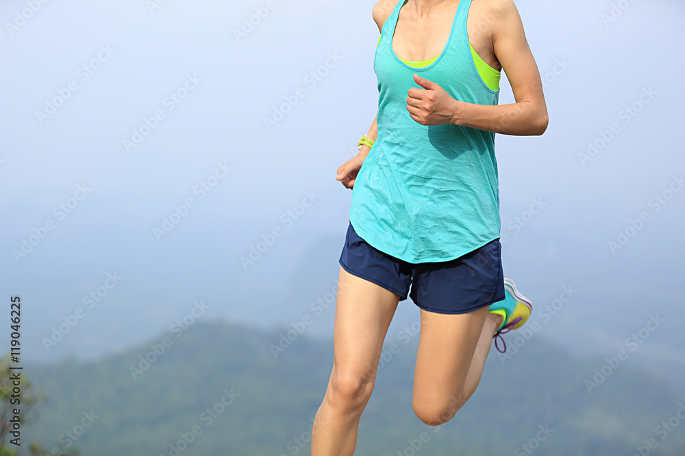 young fitness woman runner running on sunrise seaside trail young fitness woman runner running on sunrise seaside trail