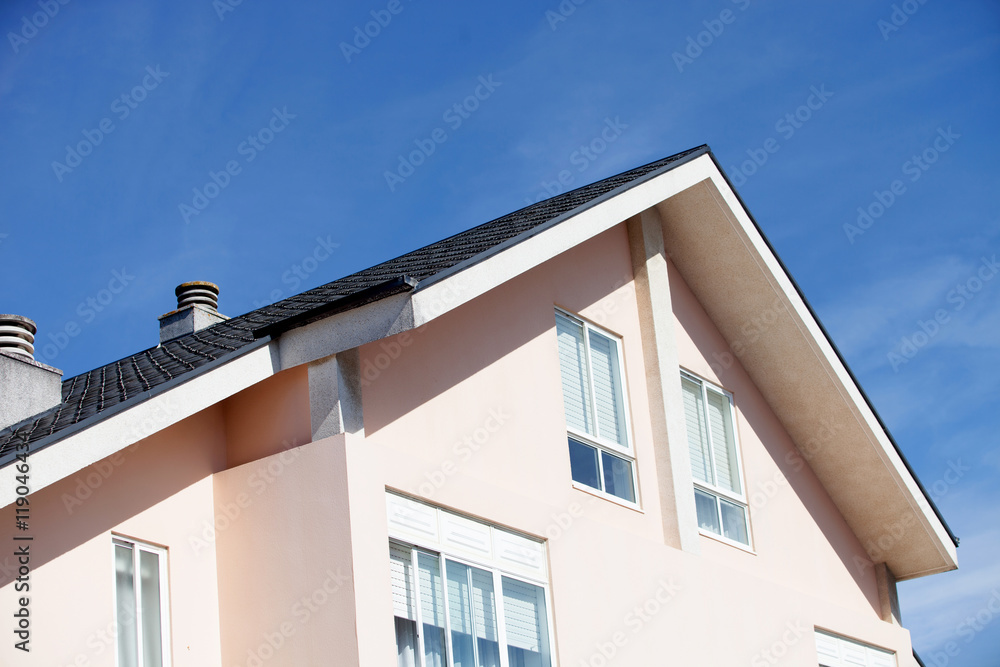 Facade of a beautiful house with a gabled roof Facade of a beautiful house with a gabled roof
